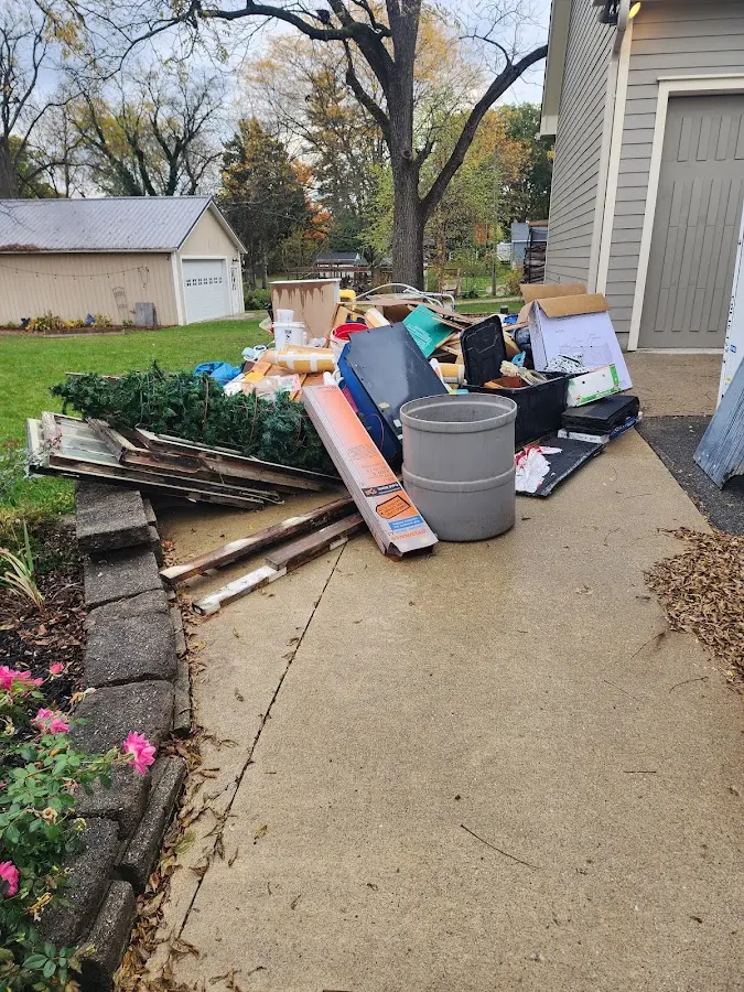 Dumpster being loaded with debris for Roofing Dumpster Rental in Caldwell